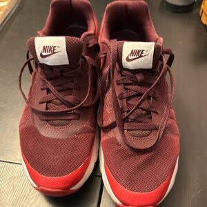 Men’s Nike Invigor Red color with white swoosh size 10.5